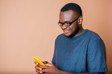 Image of an African man using his mobile phone