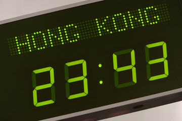 Low angle view of international time zone digital clock on wall in office, Hong Kong