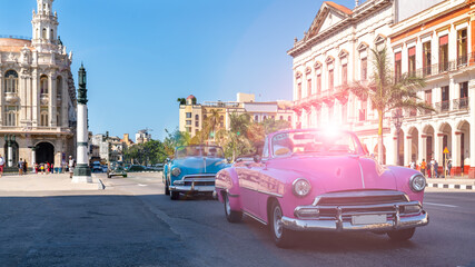 Vintage classic American oldtimer car in the old town of Havana, Cuba. Colorful scene of the...