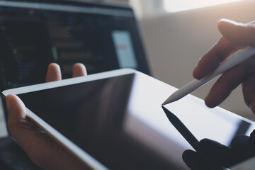 man coding programmer hand using stylus pen on digital tablet