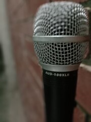 silver color microphone on a blur background