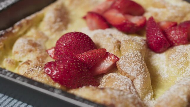 A Panakuken with Strawberries and Powdered Sugar - Close Up