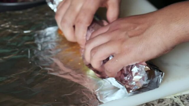Kebab and salad wrapped in aluminium foil