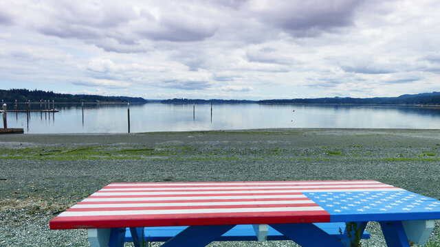 picnic table with USA flag painting  on the beach
