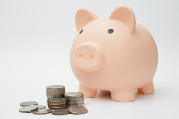 Piggy bank and Stack of coins  on white background