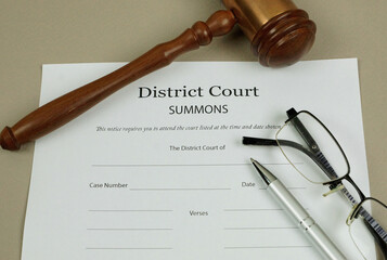 Summons Form for a District Court with gavel.