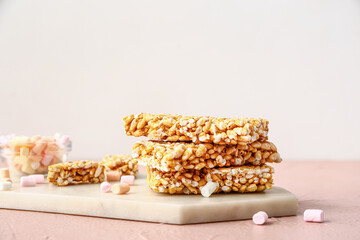 Board with crispy rice bars on table