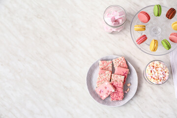 Naklejka premium Plate with crispy rice bars and sweets on white background