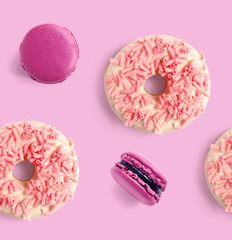 Seamless pattern made of purple macaroon and pink donut. Flat lay. Food concept.