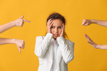 People bullying African-American woman on color background. Stop racism