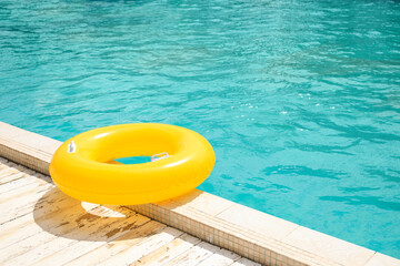 Inflatable ring on the edge of swimming pool