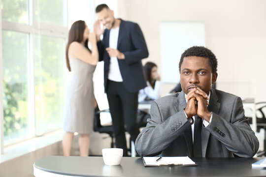 Lonely African-American Businessman In Office. Stop Racism