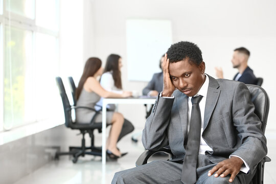 Lonely African-American Businessman In Office. Stop Racism