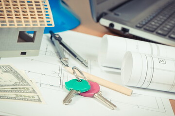 Home keys, currencies dollar, electrical diagrams and accessories for engineer jobs, building home cost concept