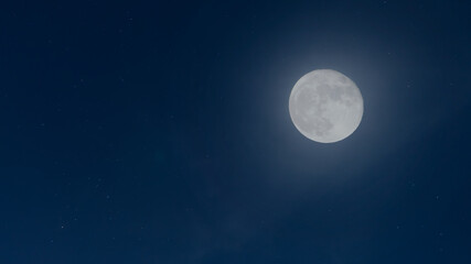 Naklejka na ściany i meble Full moon at night with beautiful stars beside nature