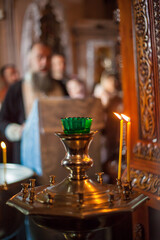 A candle burns in the temple. Interior of the Christian Church.