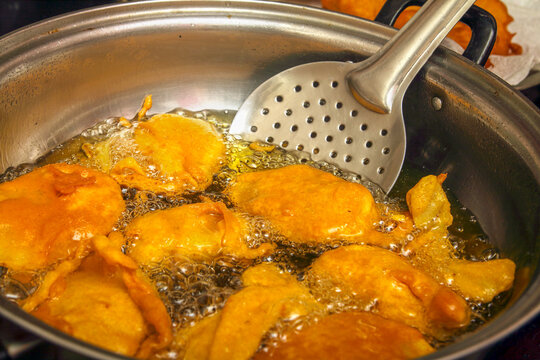 Indian home made bajji frying in oil	
