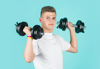 Fototapeta na wymiar Real professional. healthy lifestyle. dieting for athletics. strong man workout in gym. teen boy training with barbells. sport and fitness. teen guy hold dumbbell. sportswear and equipment shop
