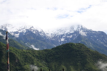 mountains covered in fog and hills