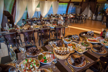 Tables served with food and drink in the restaurant.