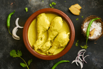 Chicken Korma curry with coconut milk, turmeric, spices mild spicy meat dish, Delhi, India. Top view of North Indian side dish non vegetarian food for Chapati, Naan, Roti, Rice.
