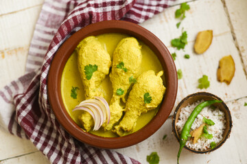 Chicken Korma curry with coconut milk, turmeric, spices mild spicy meat dish, Delhi, India. Top view of North Indian side dish non vegetarian food for Chapati, Naan, Roti, Rice.