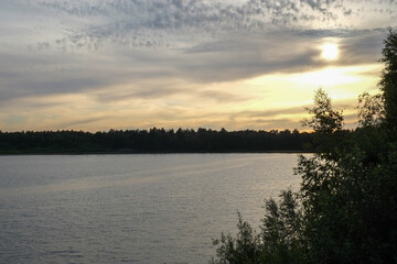 Obraz premium Dramatic and colorful sunset over a forest lake reflected in the water. Blakheide, Beerse, Belgium. High quality photo