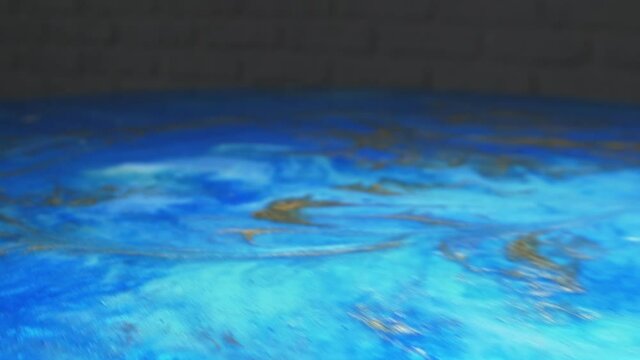 super close up. trendy background. colored epoxy on canvas. handmade