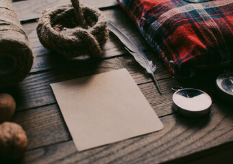 Hipster traveler hiking pack. Set for hiking in the mountains or forest. Scout concept. Rustic flat lay on a wooden table. Hipster lumberjack flat lay.