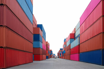 Stack of container box in transportation port with isolated sky