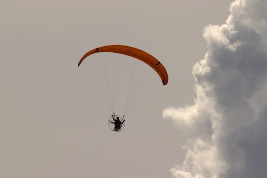Storm clouds brewing with a para-glider enjoying the calm