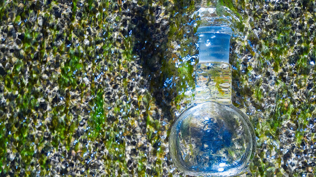 Glass flask with clear water.