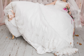 Fototapeta na wymiar bride holding a wedding bouquet in a dress