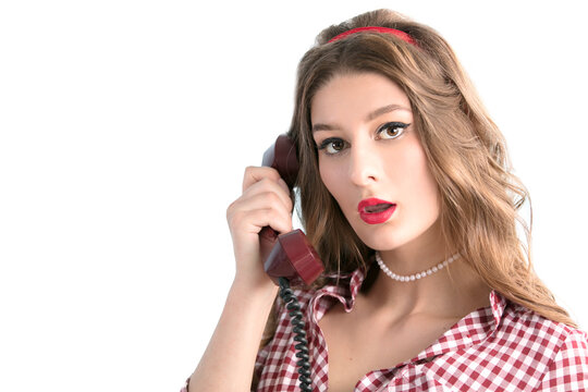 Woman in the style of the fifties. Beautiful retro woman speaks on the phone.