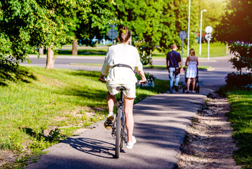 Cyclist ride on the bike path in the city Park
