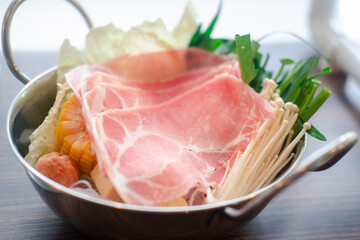 Hot pot set with fresh of vegetable and slice pork.