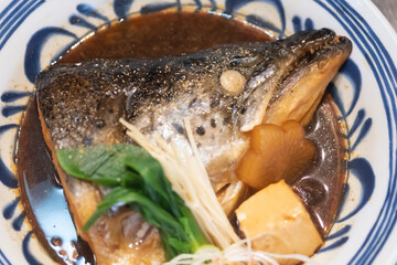 Salmon head steamed with sweet sauce and vegetable in Japanese style