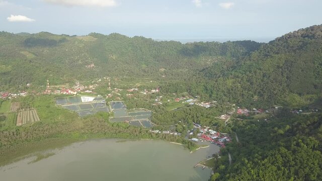 Drone shot Pulau Betong fishing village and fish farm.