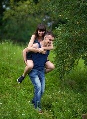 Young couple piggyback ride