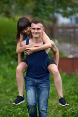 Young couple piggyback ride