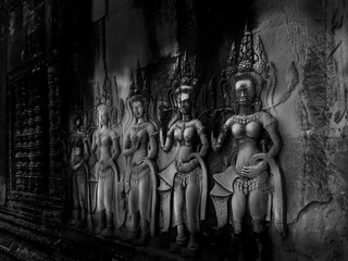 Bas-reliefs of a few devatas in the archaeological place of angkor wat in siam reap, cambodia