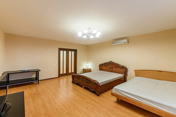 Fototapeta premium Russia, Moscow- February 10, 2020: interior room apartment modern bright cozy atmosphere. general cleaning, home decoration, preparation of house for sale, bedroom with bed