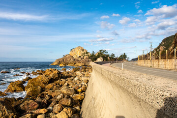 Empty national route 249 along Sosogi coastline on Noto Peninsula, Japan, with scenic sea view and...