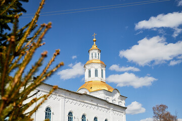 Fototapeta na wymiar Traditional russian church with domes in nature landscape. Architecture in the Orthodox religion