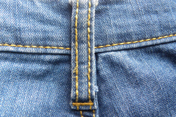 Belt loop hole detail of blue jeans