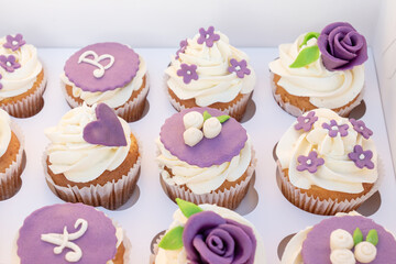 Set of different delicious cupcakes in a paper box for celebration