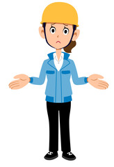 呆れるヘルメットを被った作業着の女性
