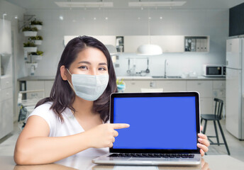 Fototapeta na wymiar asian woman point to blank laptop screen to display