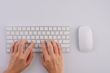Closeup of business woman hand typing on laptop keyboard with mouse