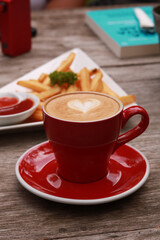 coffe latte cup on a wood table.